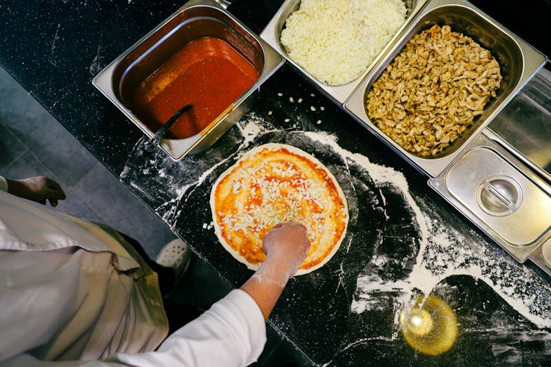 Green lantern pizza catering team preparing food for a large event