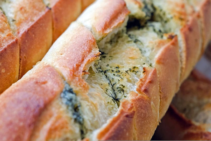 Garlic breadsticks with dipping sauce catering side